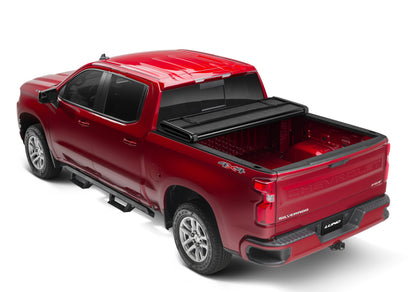 Lund 05-15 Toyota Tacoma Fleetside (6ft. Bed) Hard Fold Tonneau Cover - Black